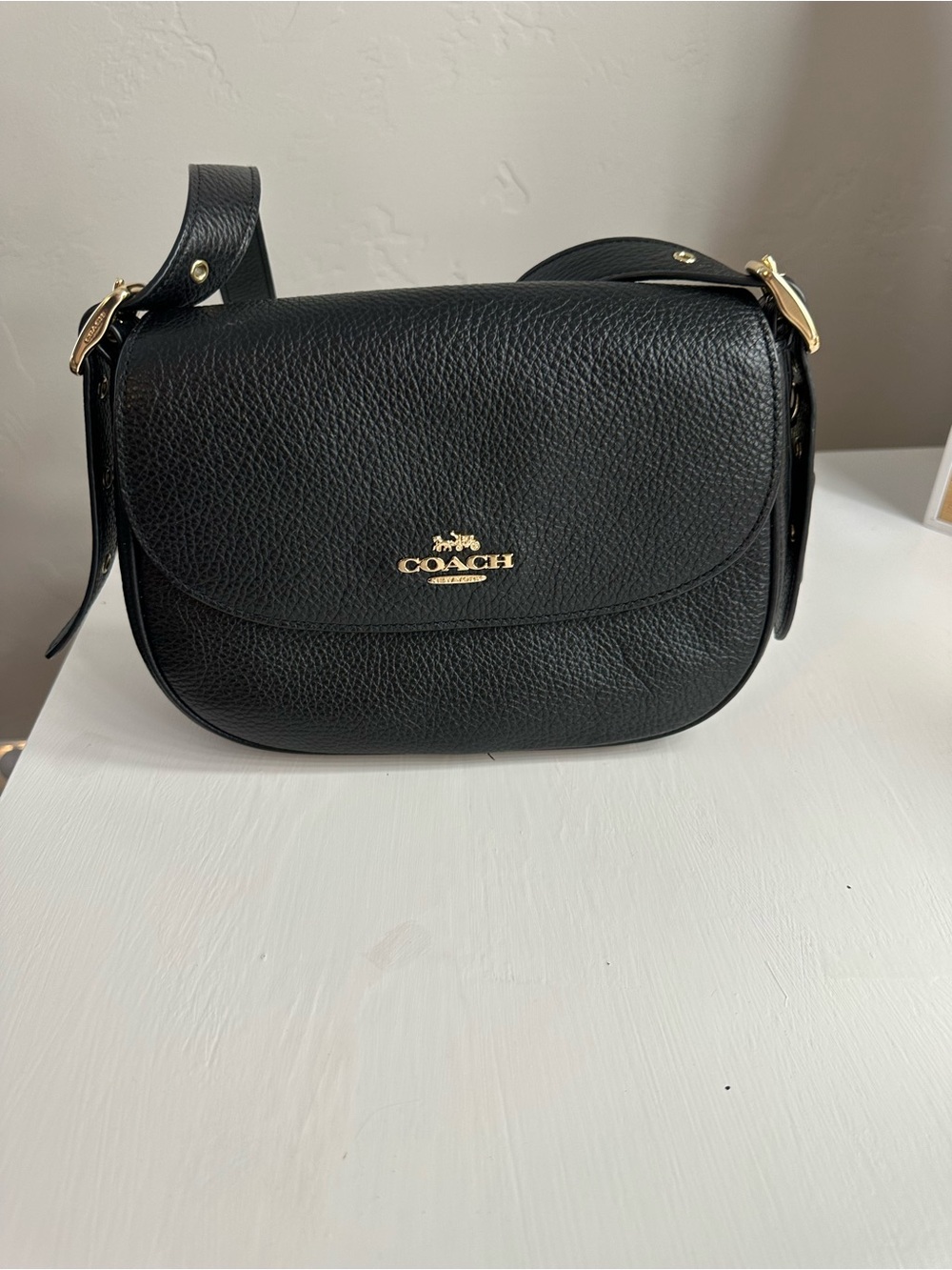 COACH black and gold leather crossbody